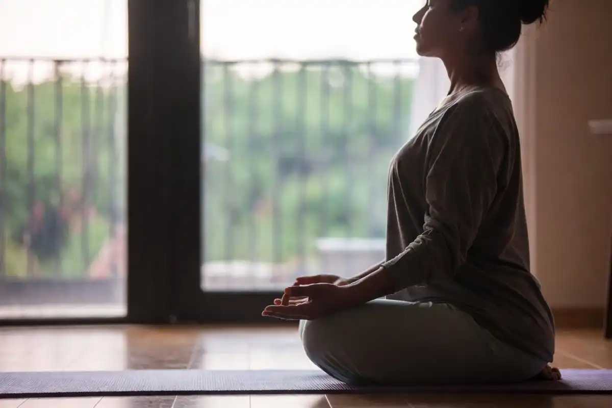 Person practicing mindfulness as part of a 10x health mental wellness routine