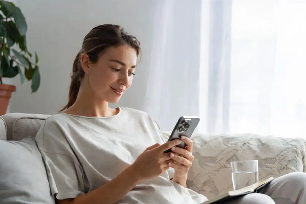 Person using Brello Health telehealth app on smartphone