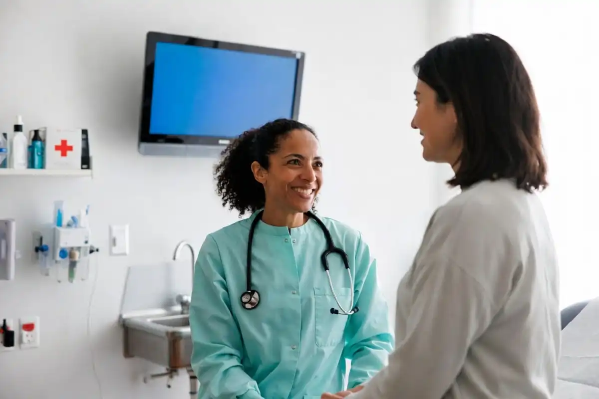 Carbon Health doctor consulting patient in modern clinic