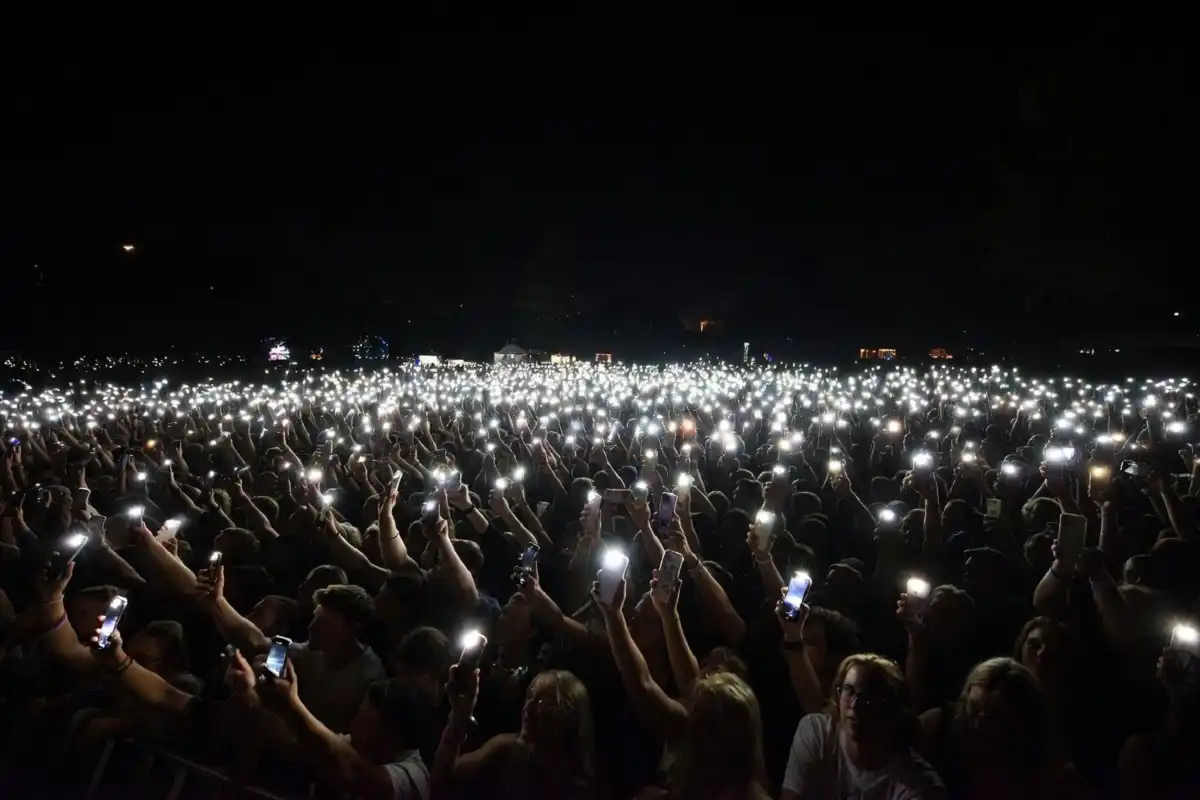 Concert crowd showing support representing fan response to Randy Travis health journey