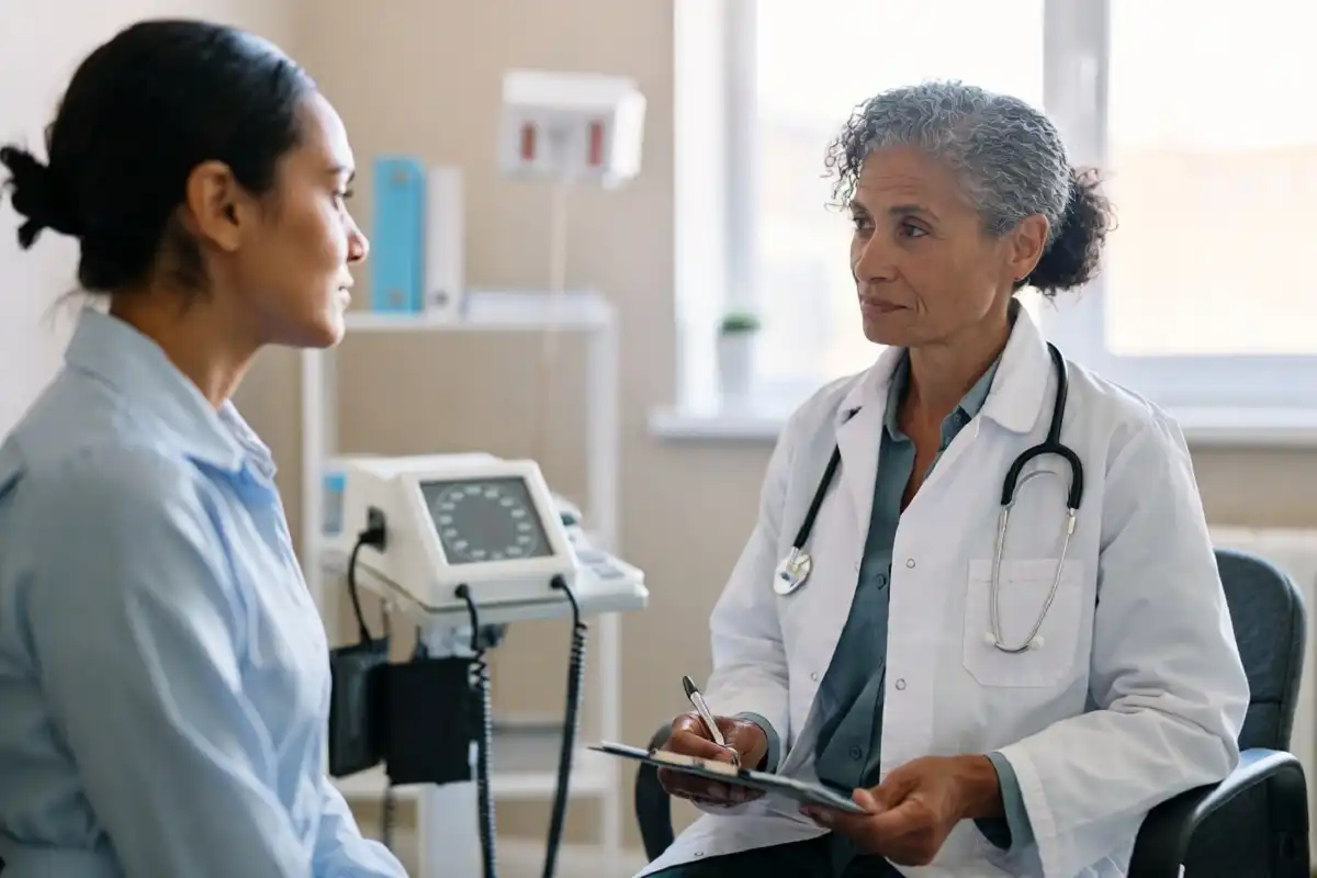 Doctor consulting with a patient inside a Sutter Health clinic exam room